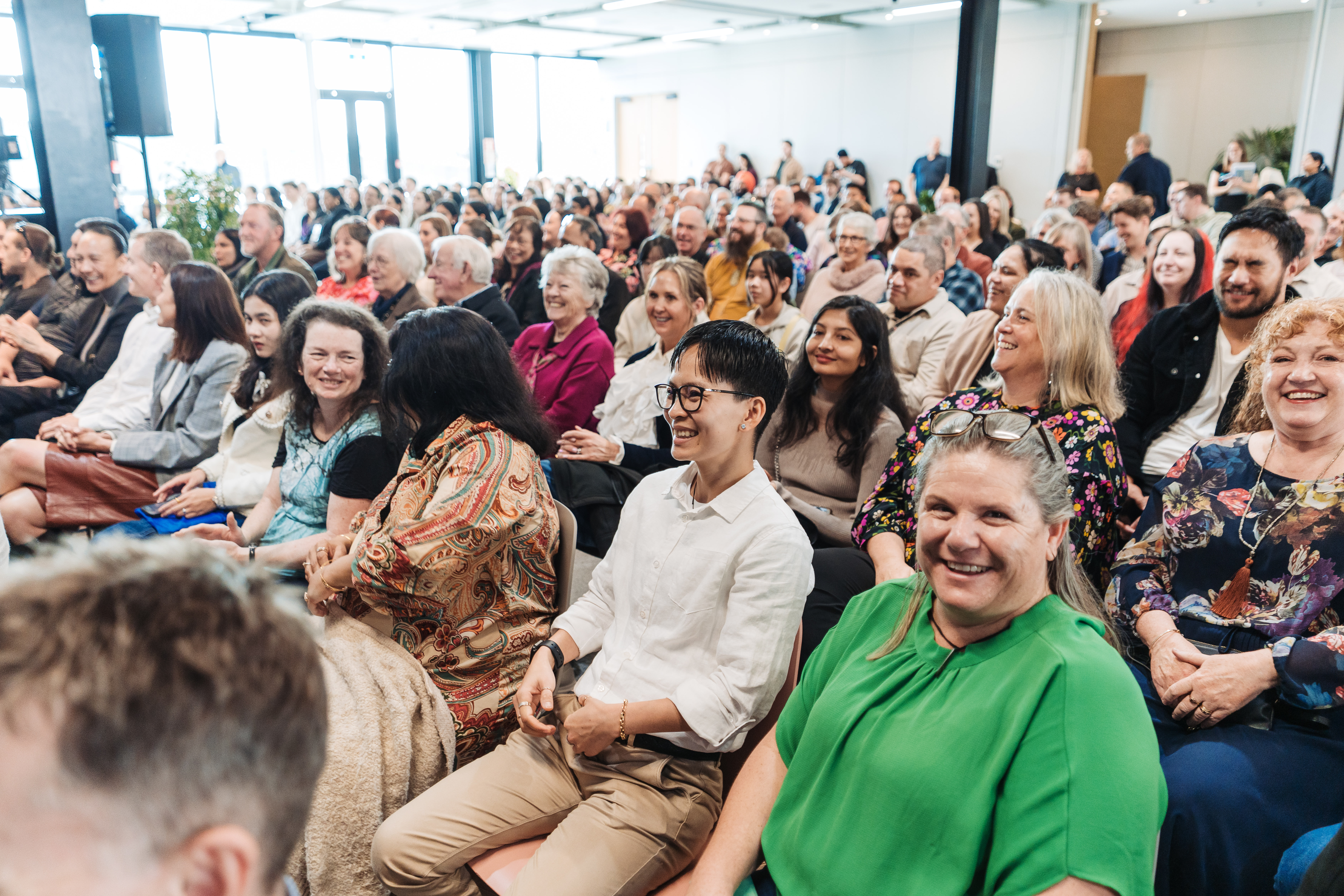 So_many_smiling_faces_celebrating_their_loved_ones_at_Graduation.jpg