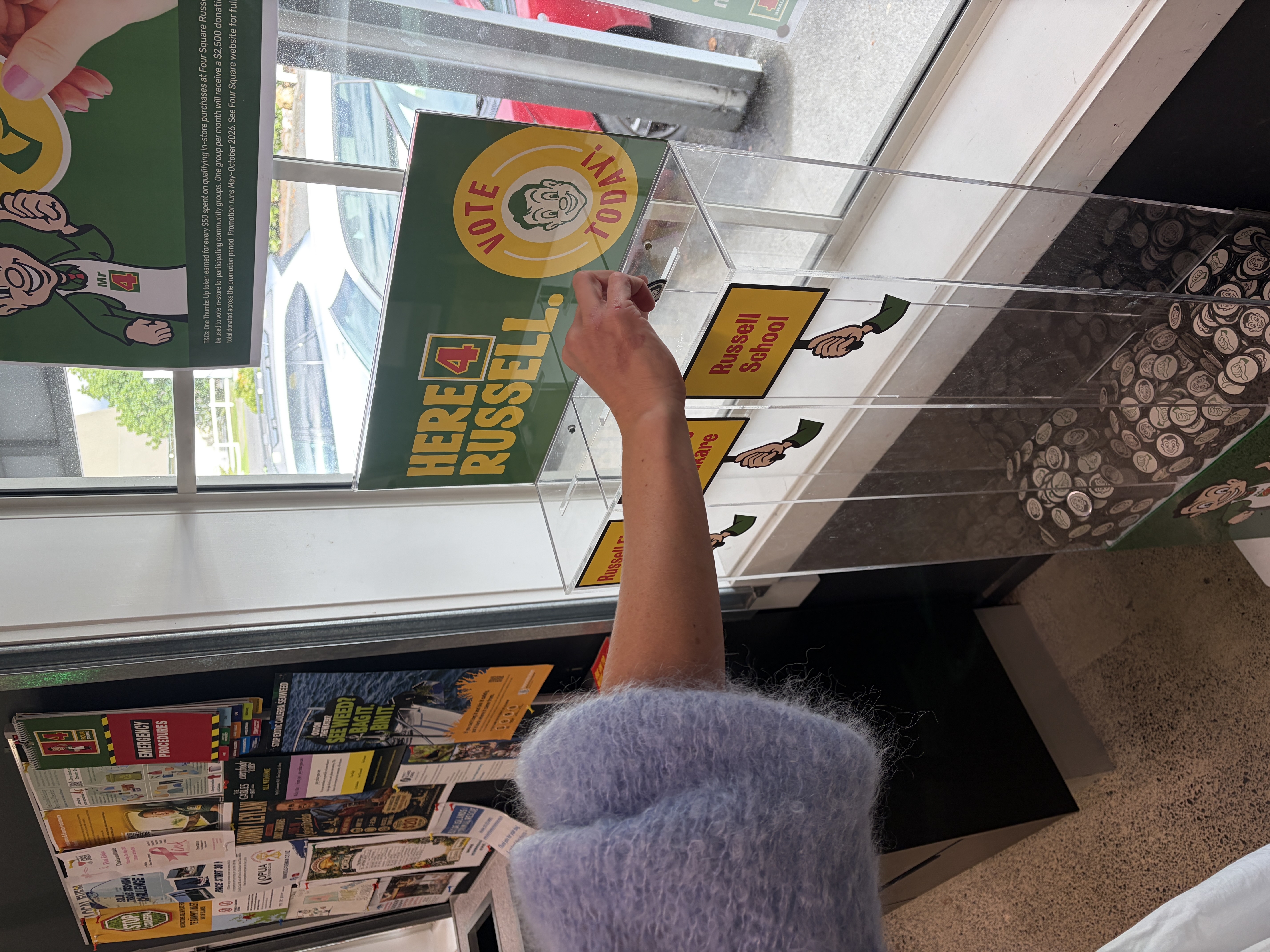 Alysse_placing_her_token_into_the_in-store_display_after_her_shop.jpg