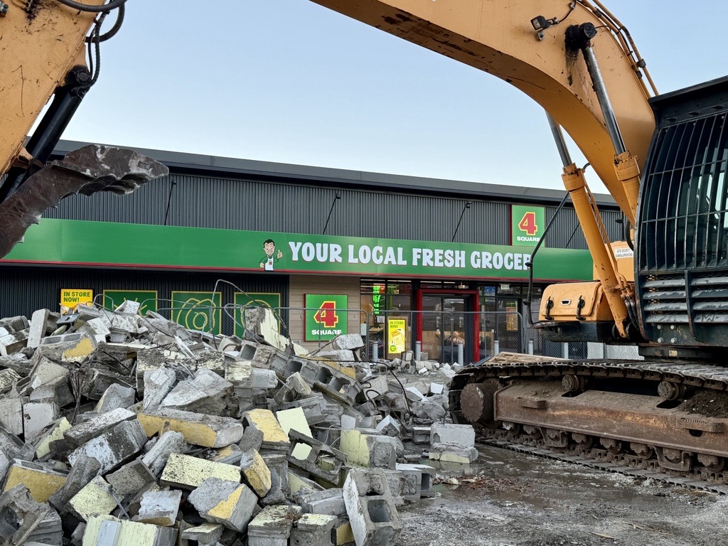 The_old_Four_Square_Te_Puna_store_was_demolished_to_make_room_for_the_new_Four_Square_Te_Puna_behind.jpg