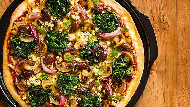 Spinach, olive and feta pizza