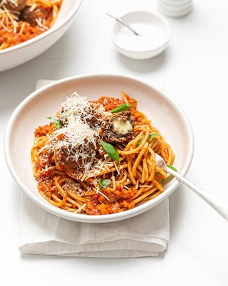 Mozzarella stuffed meatballs and spaghetti