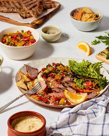BBQ steak with hummus and tomato salsa