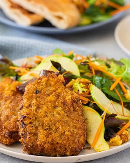Beef schnitzel with pear and walnut salad