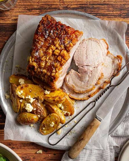 Crackled pork with herby potatoes