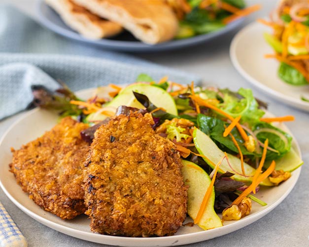 Beef schnitzel with pear and walnut salad
