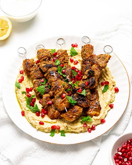 BBQ lamb skewers with hummus and mint