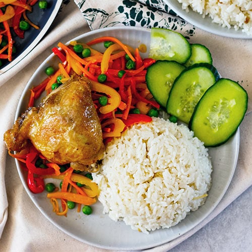 Chicken rice and stir-fried vegetables