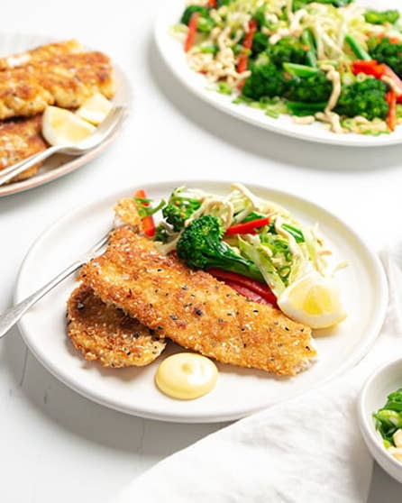 Sesame crumbed fish and greens salad