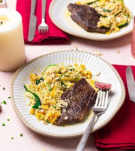 Herby buttered steaks