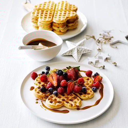 Waffles and berries with salted caramel sauce