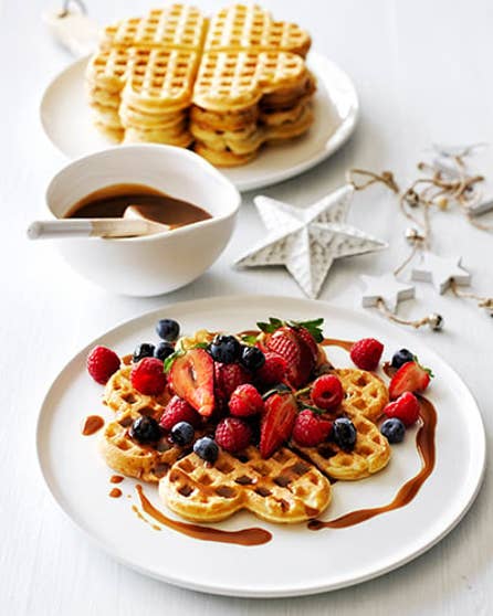 Waffles and berries with salted caramel sauce