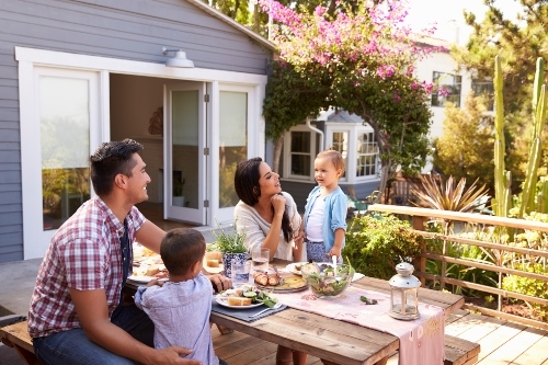 Family having dinner outside 500px
