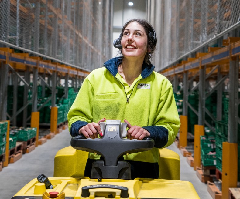 Female on Hyster Order Picker Down Aisle 1 790x656.jpg